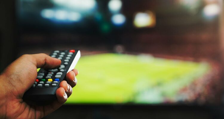 how to watch football on tv remote pointing at screen